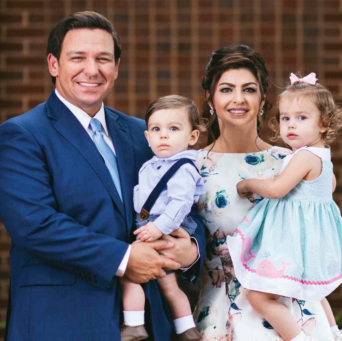 Image of a prominent government official, Casey DeSantis with her husband and kids