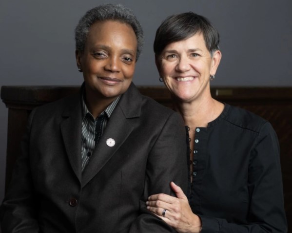 Image of African-American Mayor, Lori Lightfoot and her wife, Amy Eshleman