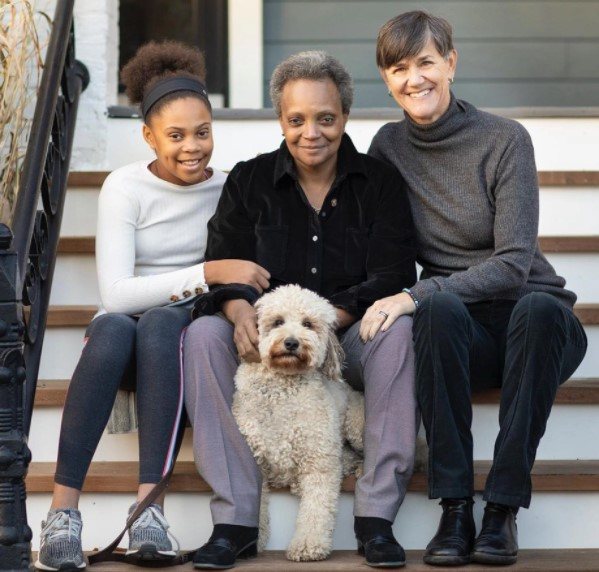 Image of African-American Mayor, Lori Lightfoot and her wife, and daughter